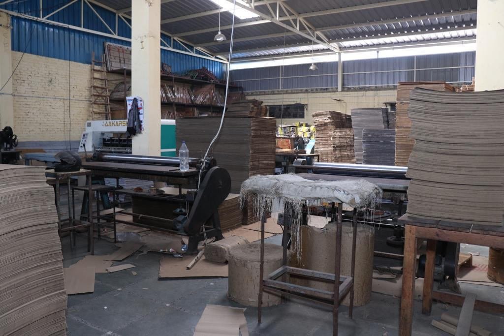 Packaging conversion floor with stacked carton sheets